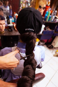 a hairdresser cutting a woman's hair