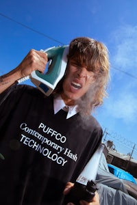 a man wearing a t-shirt with the word "puffog" on it